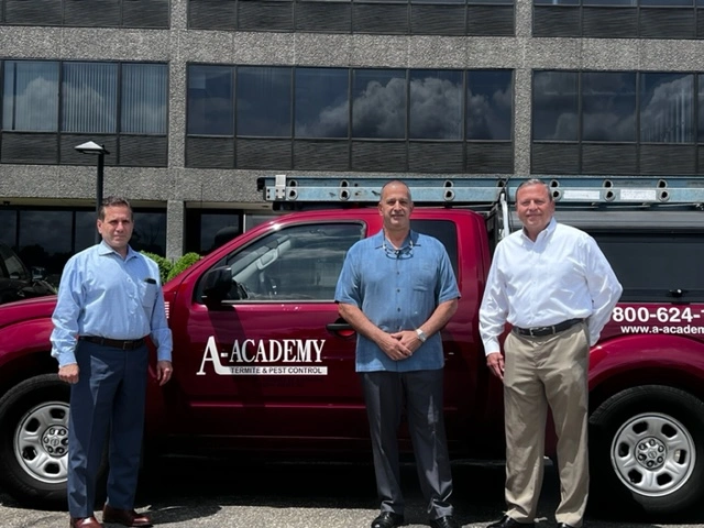 A-Academy founder standing in front of a company truck